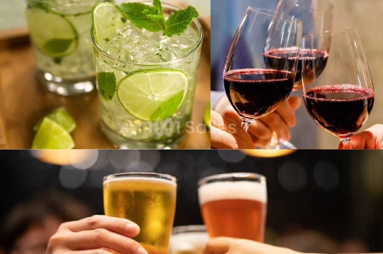 Verres de cocktails, de vin rouge et de bière levés dans un contexte festif.