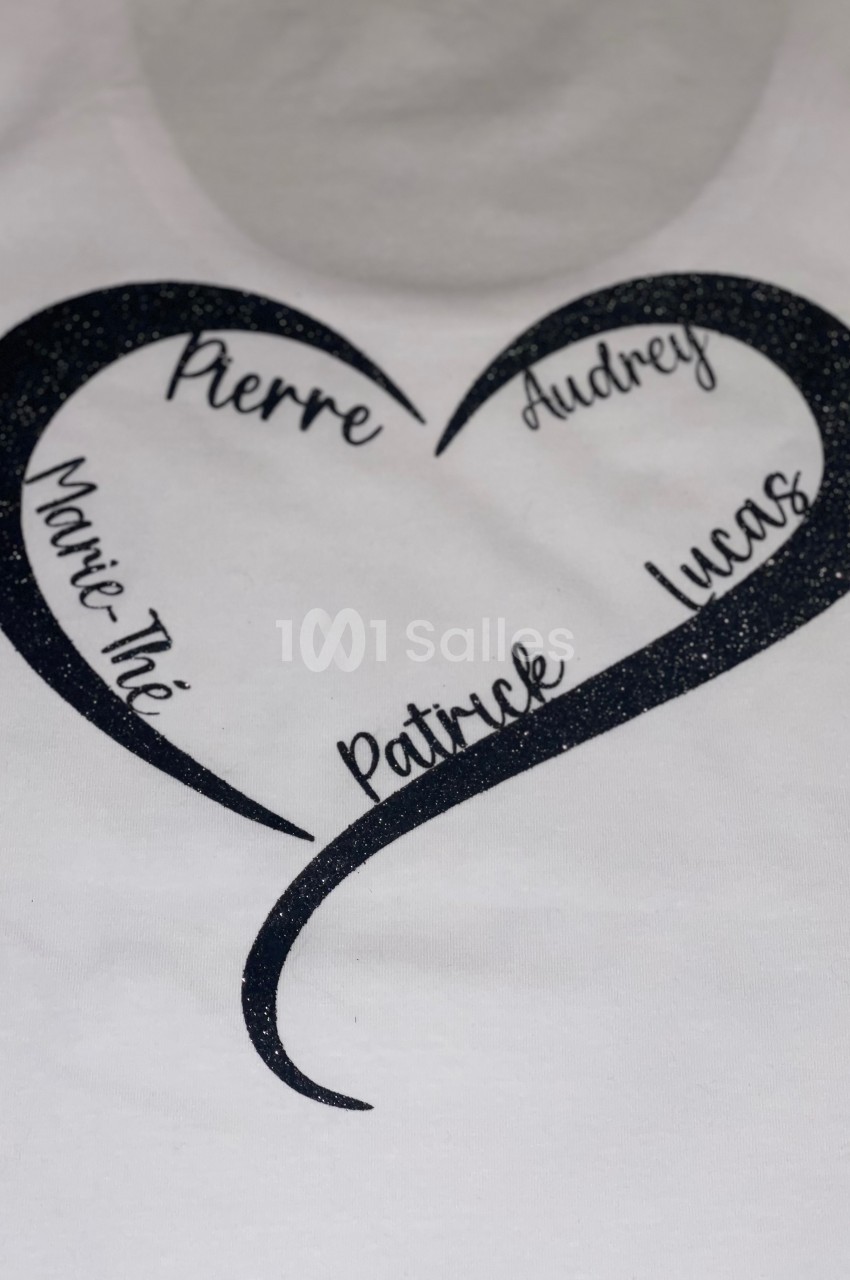 Cœur noir stylisé avec les prénoms ’Pierre’, ’Audrey’, ’Marie-Thé’, ’Patrick’ et ’Lucas’ inscrits à l'intérieur.